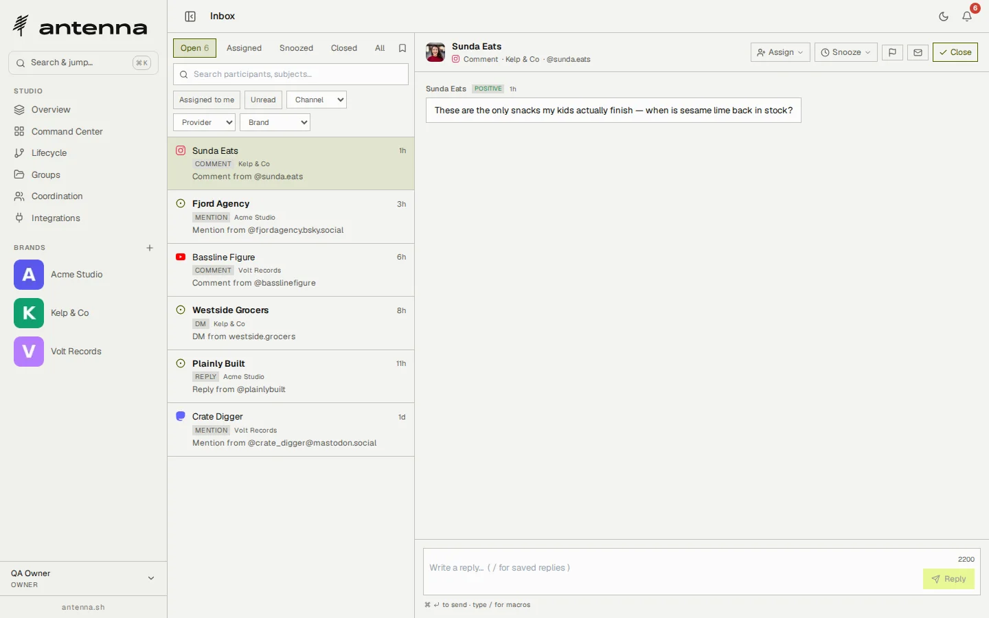 Antenna's unified inbox: open threads from Instagram, Bluesky, YouTube, Facebook and Mastodon across three brands, with an Instagram comment selected and a reply box below